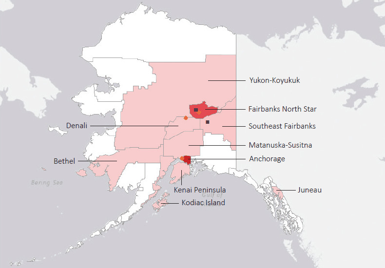 Map presenting top defense personnel spending locations within the state of Alaska with an overlay showing the positions of key military installations differentiated by service and active/reserve affiliation.