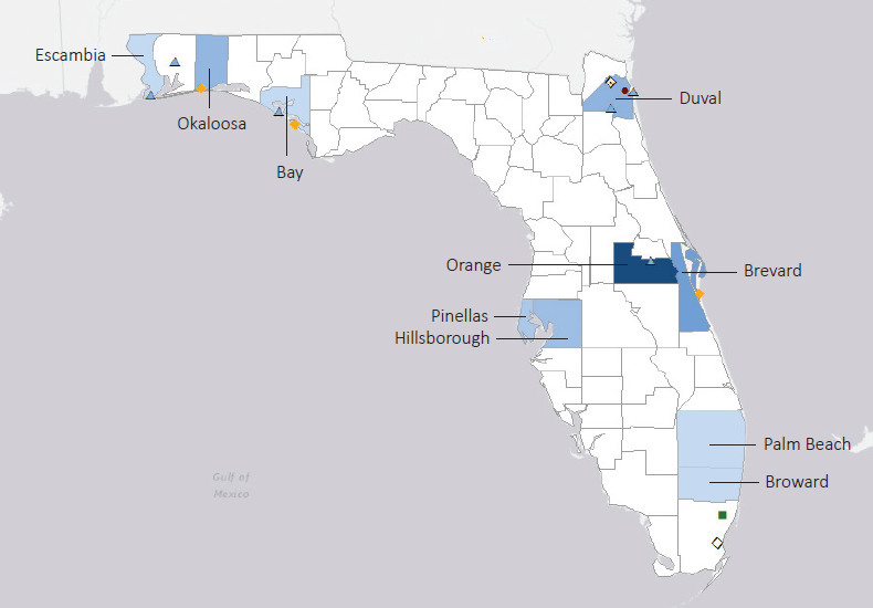 Map presenting top defense contract spending locations within the state of Florida with an overlay showing the positions of key military installations differentiated by service and active/reserve affiliation.