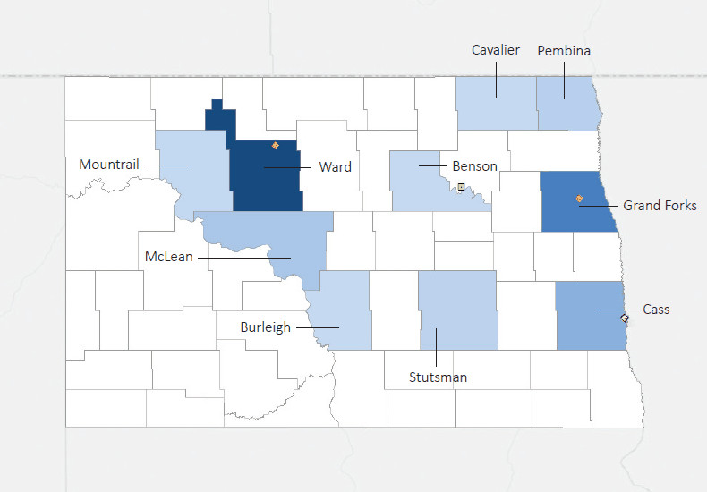 Map presenting top defense contract spending locations within the state of North Dakota with an overlay showing the positions of key military installations differentiated by service and active/reserve affiliation.