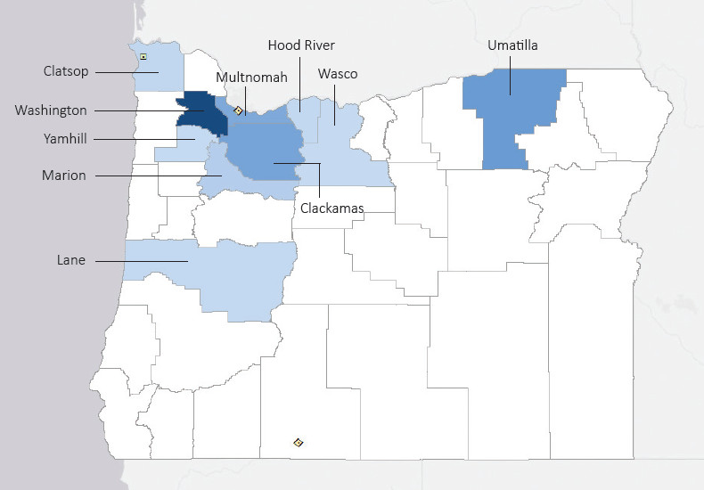 Map presenting top defense contract spending locations within the state of Oregon with an overlay showing the positions of key military installations differentiated by service and active/reserve affiliation.