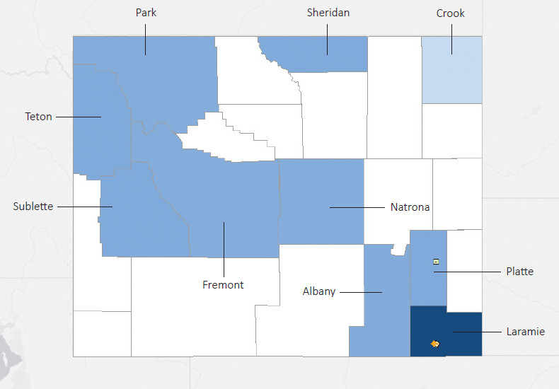 Map presenting top defense contract spending locations within the state of Wyoming with an overlay showing the positions of key military installations differentiated by service and active/reserve affiliation.